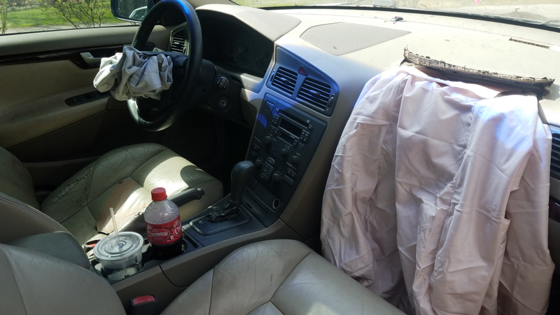 The interior of the black Volvo, post crash. Obviously.